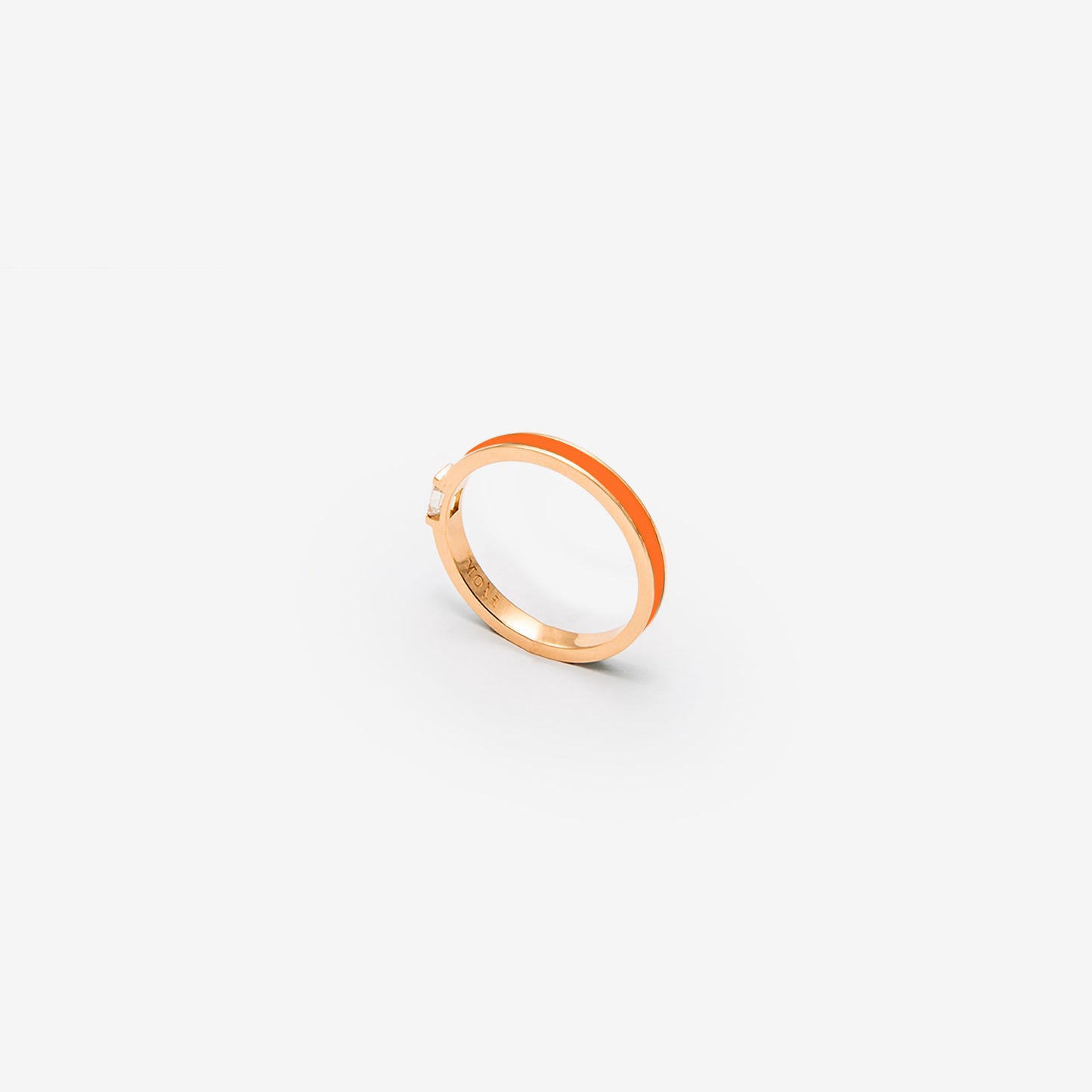 Rose gold band with orange enamel and a diamond