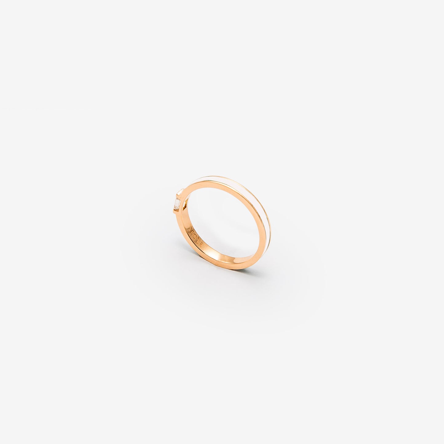 Rose gold band with white enamel and a diamond