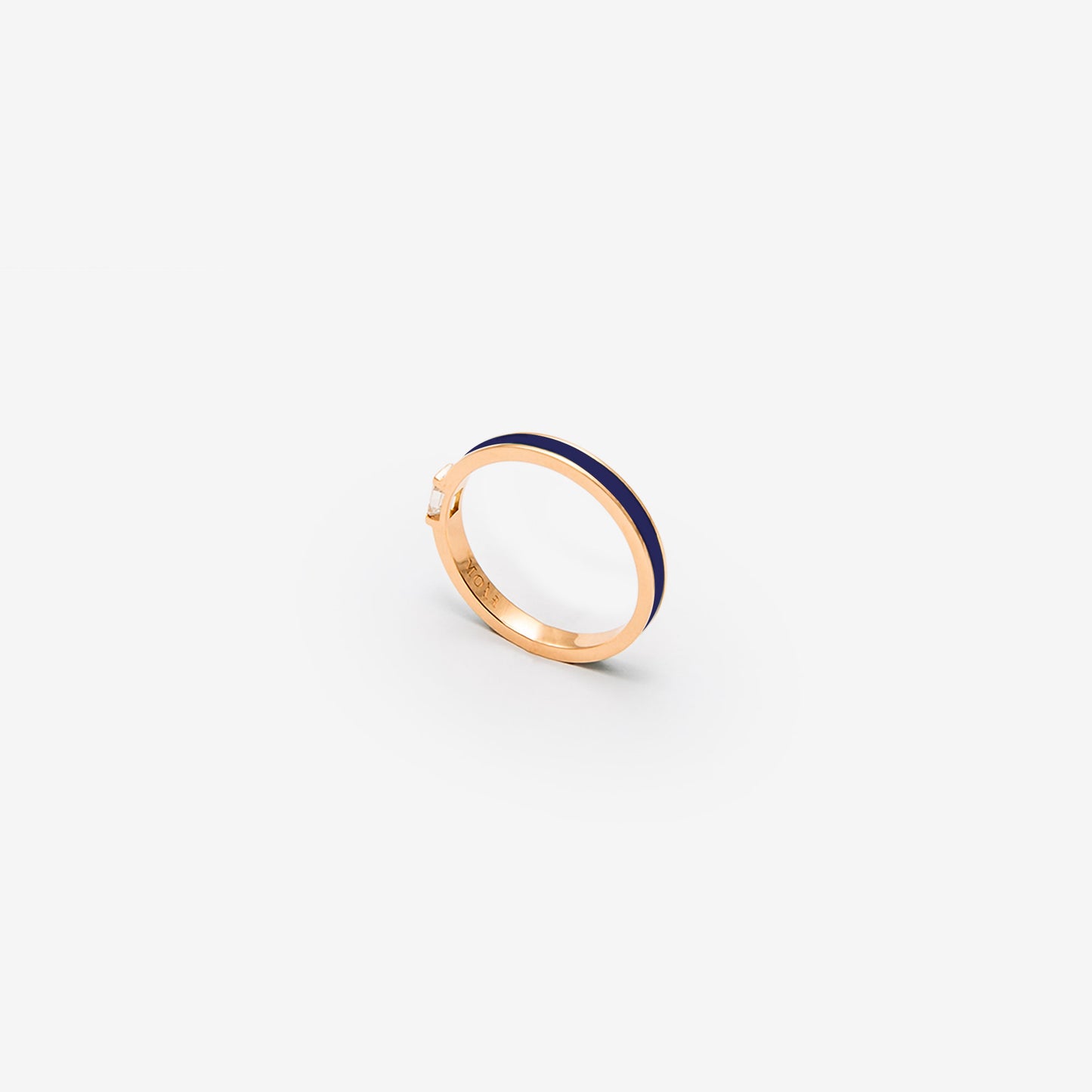 Rose gold band with dark blue enamel and a diamond