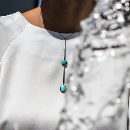 Rose gold and burnished black gold necklace with two natural Turquoise stones
