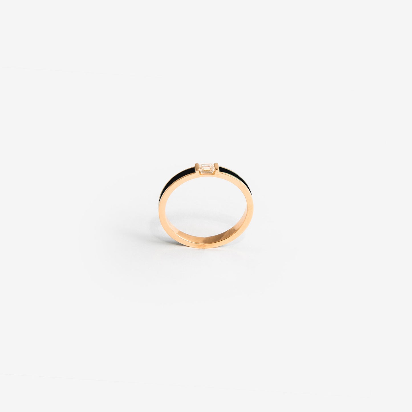 Rose gold band with black enamel and a diamond